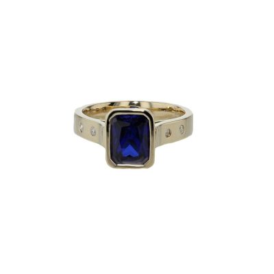 Emerald Cut Sapphire Ring with Diamonds